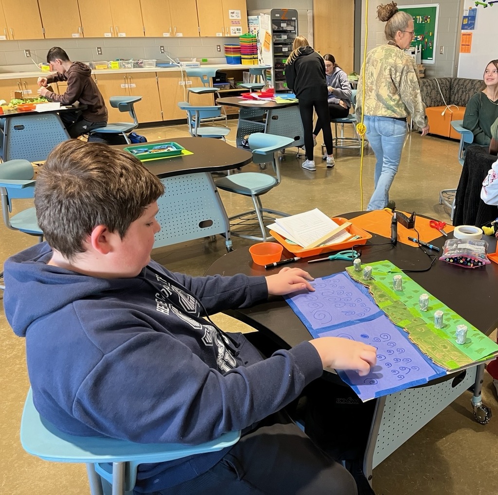 Students work on models of ancient monuments built on a 1:200 scale.