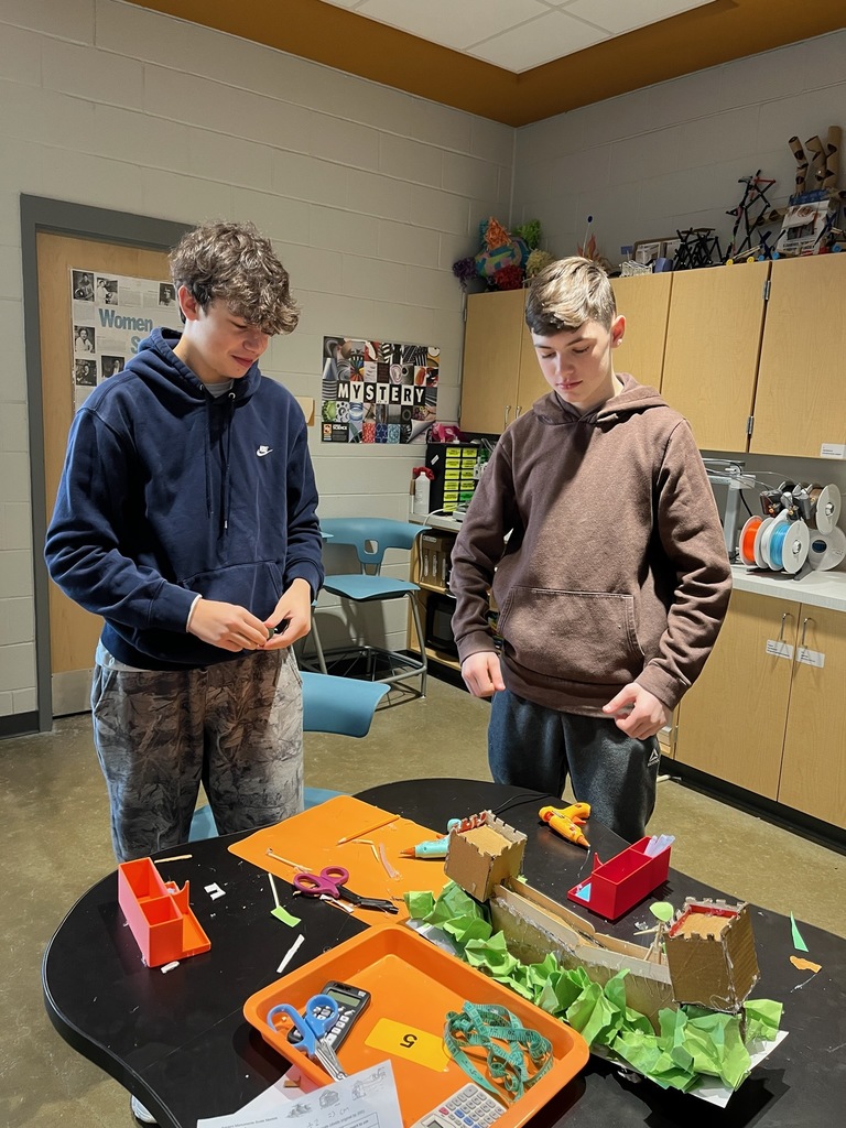 Students work on a model of an ancient monument built on a 1:200 scale.