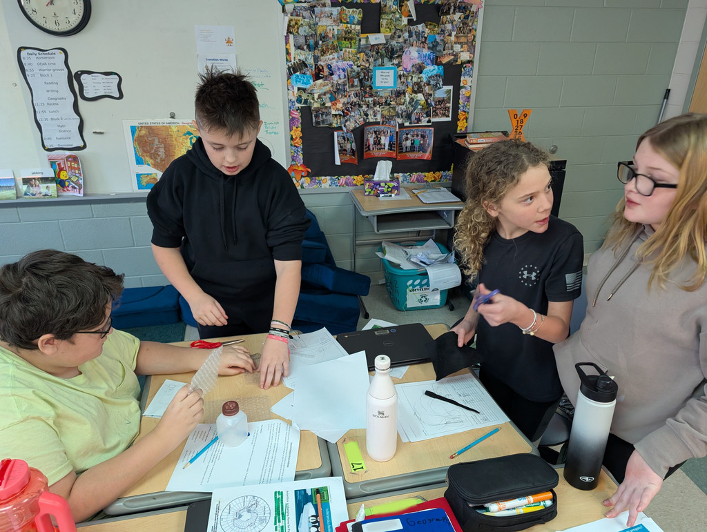 Students participate in an activity focused on thermal energy, insulators, and conductors.