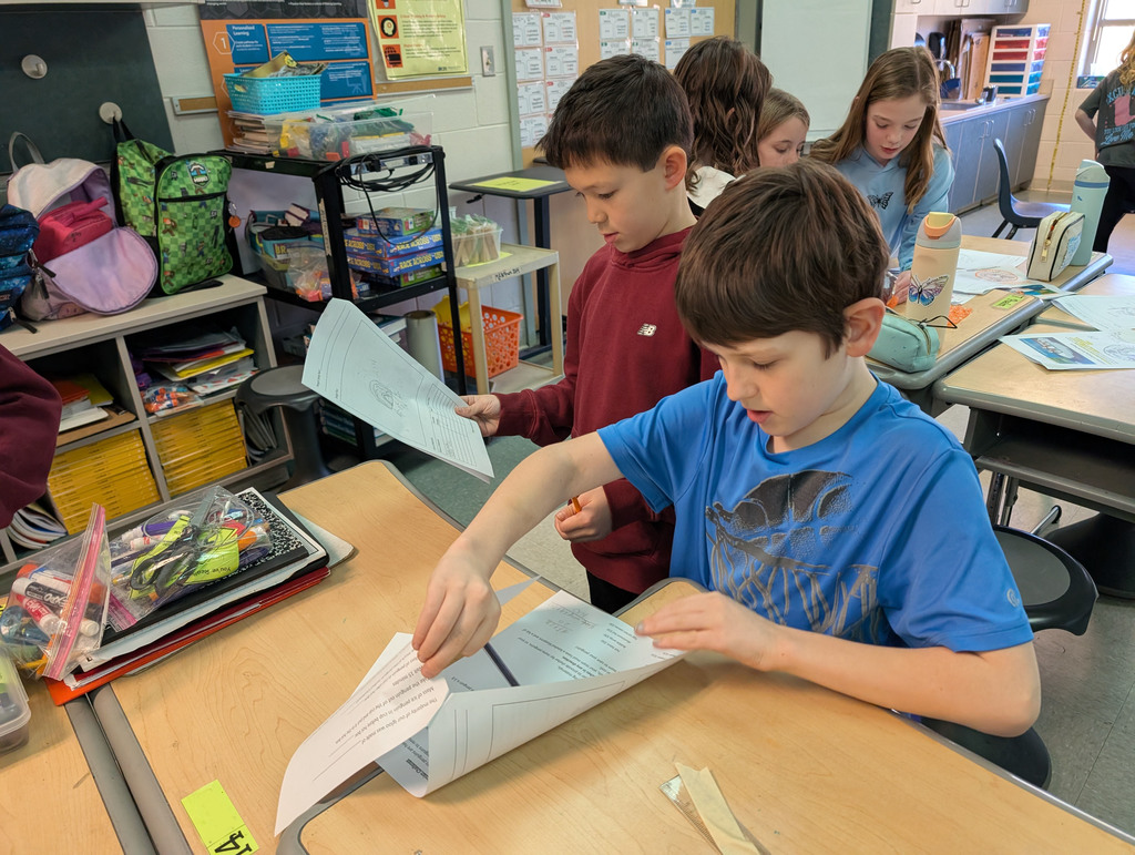 Students participate in an activity focused on thermal energy, insulators, and conductors.