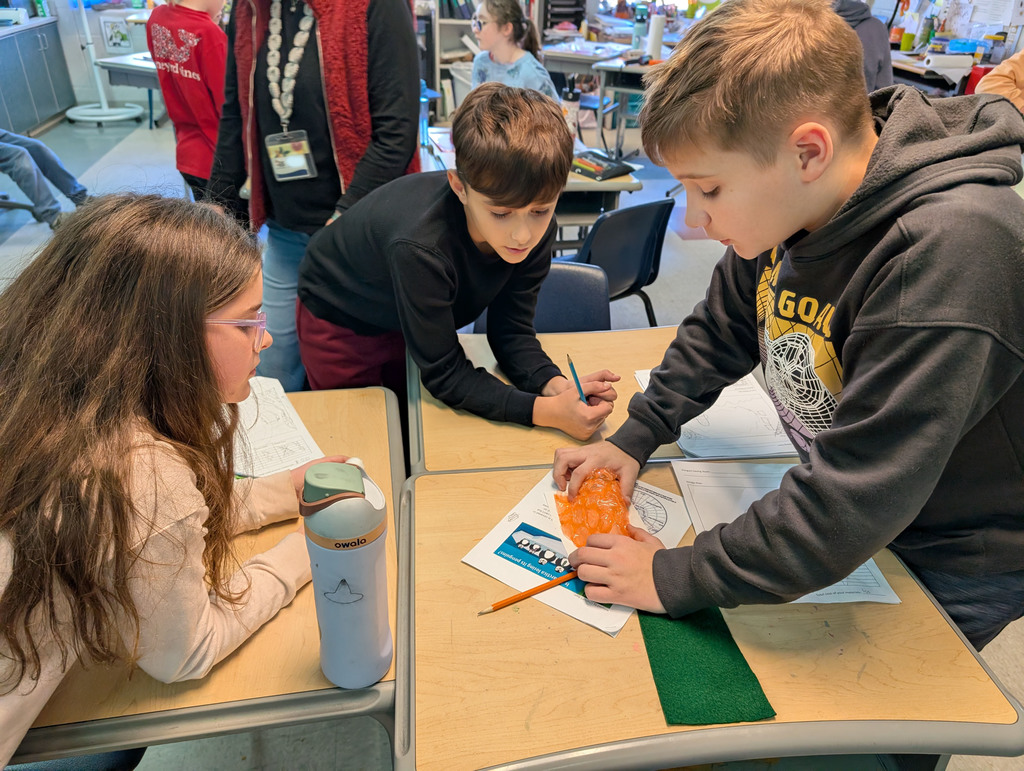 Students participate in an activity focused on thermal energy, insulators, and conductors.