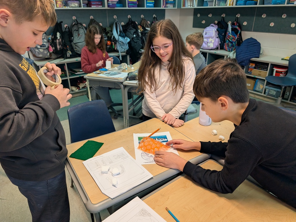 Students participate in an activity focused on thermal energy, insulators, and conductors.