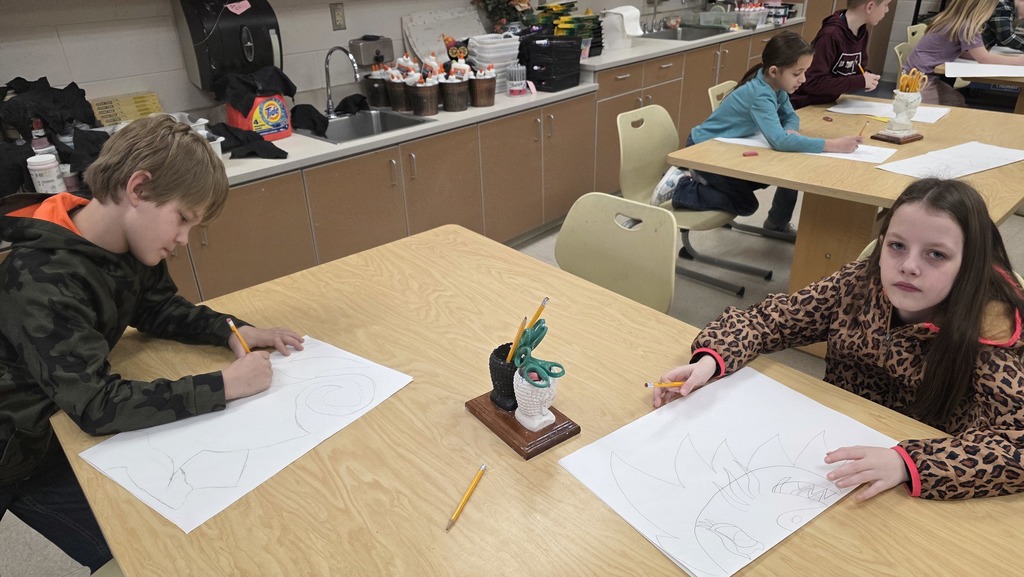 Students in art class draw ceremonial masks inspired by an African tribe.