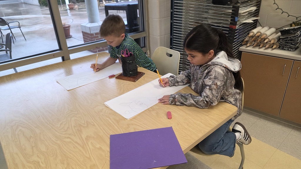 Students in art class draw ceremonial masks inspired by an African tribe.