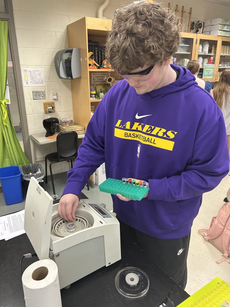 A student participates in a biotechnology lab in biology class.