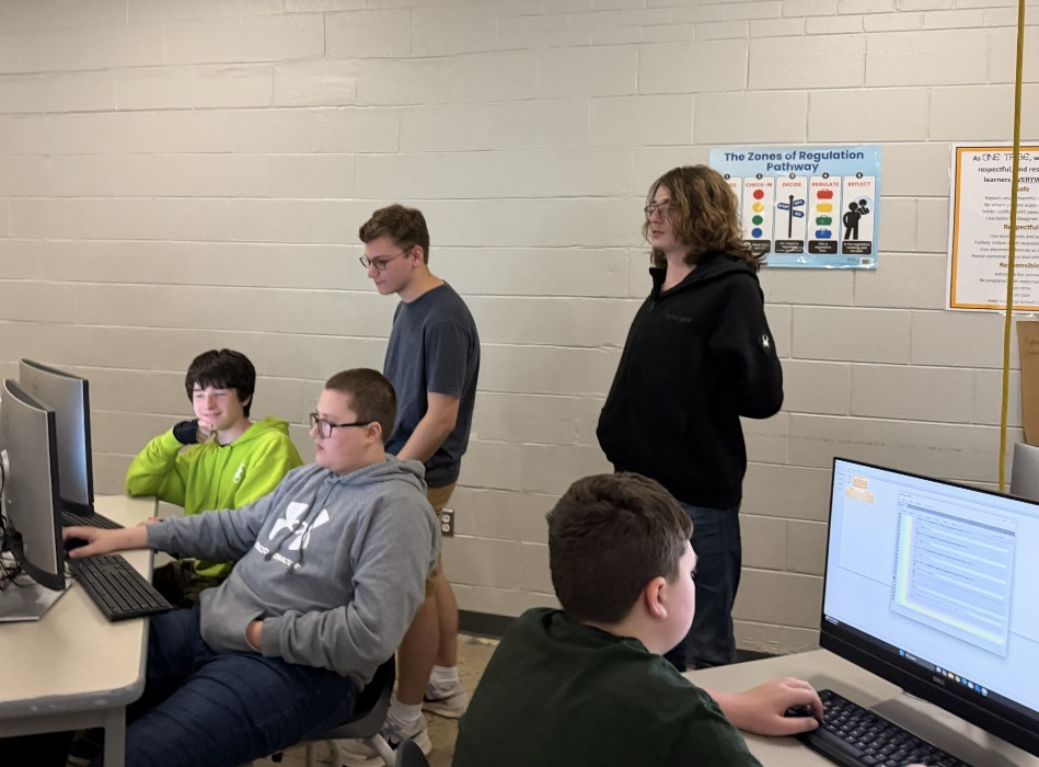 High school computer science students explore game design with middle schoolers. 