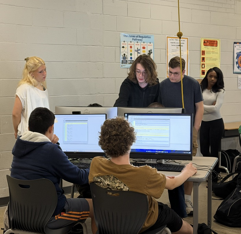 High school computer science students explore game design with middle schoolers. 