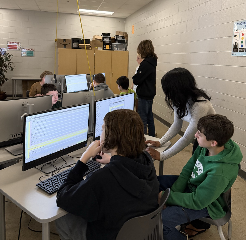High school computer science students explore game design with middle schoolers. 
