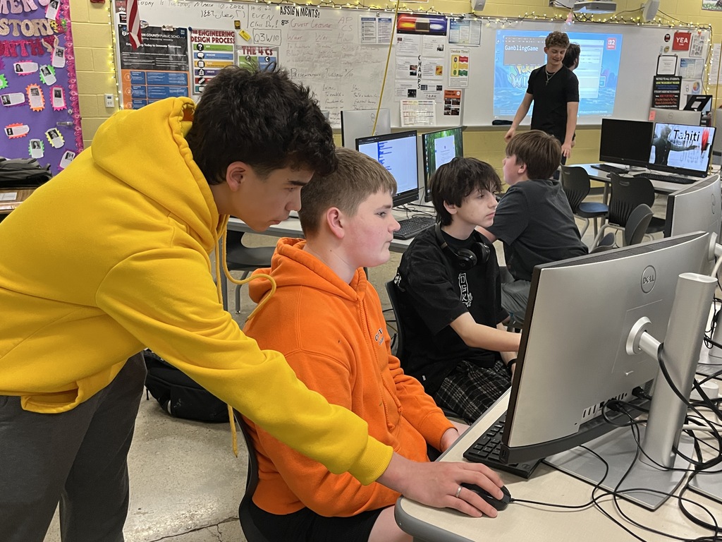 High school computer science students explore game design with middle schoolers. 