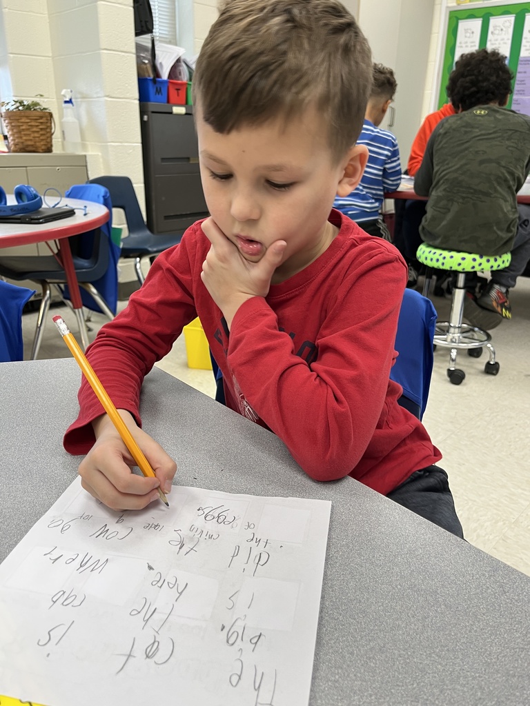 A student works on a writing assignment tied to the soft c.