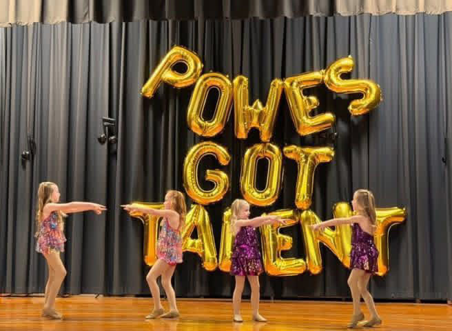 Student performers perform at a talent show.