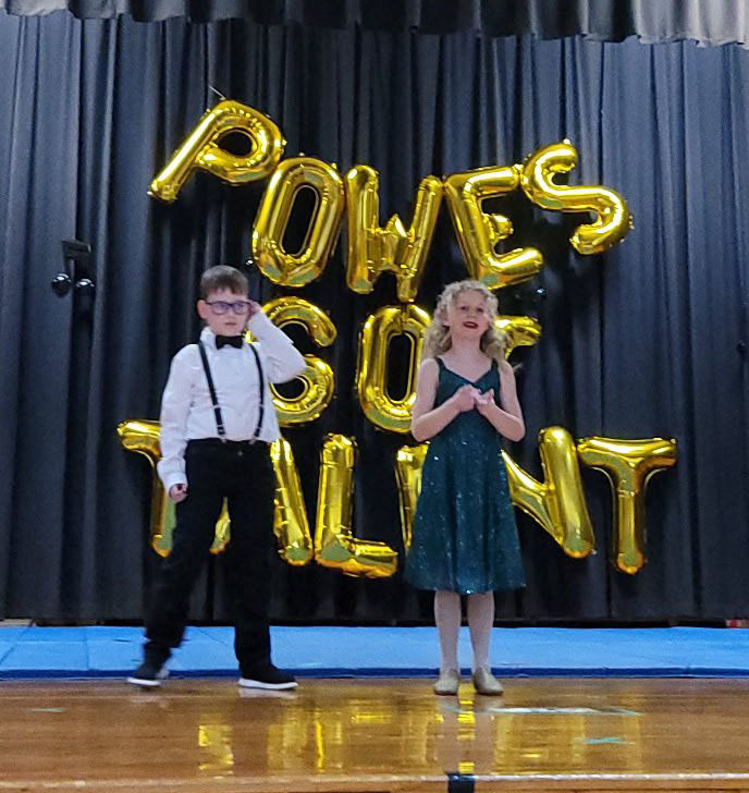 Student performers pose for photo at a talent show.
