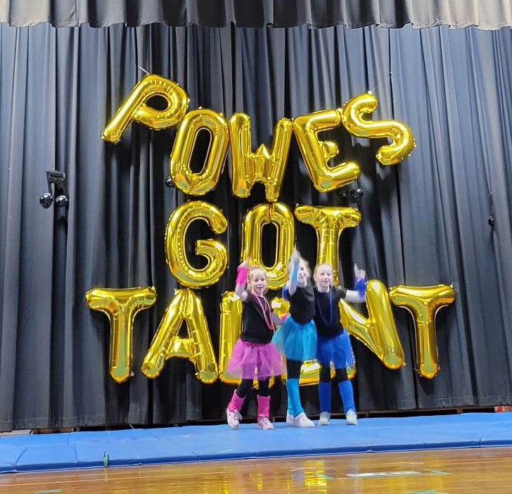 Student performers pose for photo at a talent show.