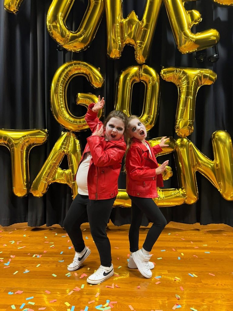 Student performers pose for photo at a talent show.