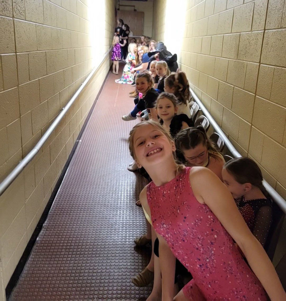 Student performers line up in preparation for a talent show.