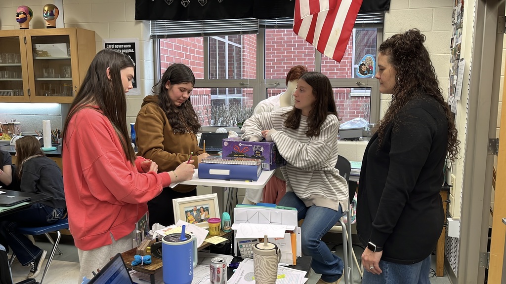 A senior participating in a Teacher for a Day activity teaches a lesson to fellow students.