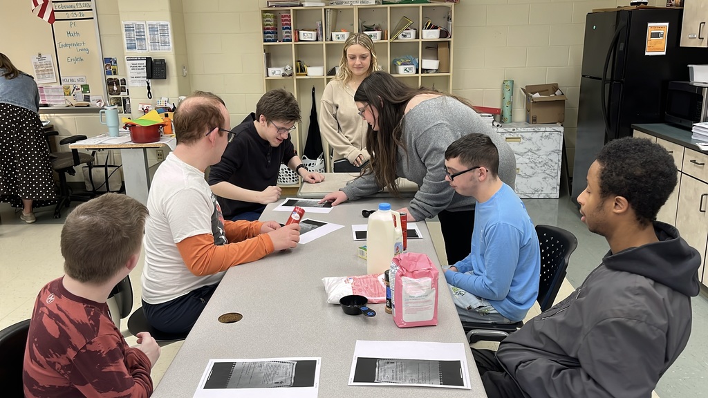 A senior participating in a Teacher for a Day activity teaches a lesson to fellow students.