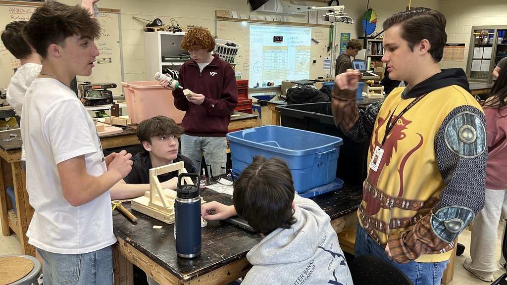 A senior participating in a Teacher for a Day activity teaches a lesson to fellow students.