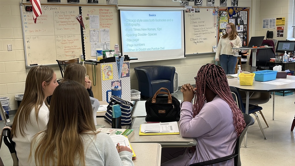 A senior participating in a Teacher for a Day activity teaches a lesson to fellow students.