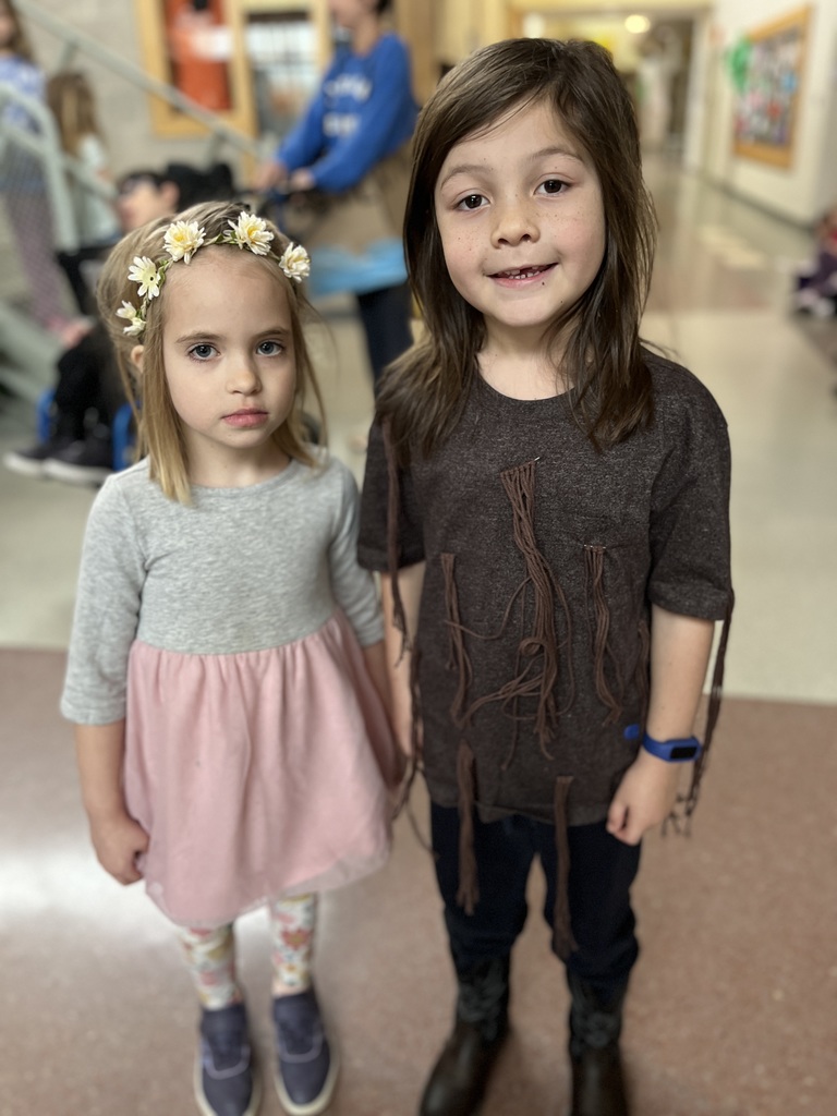 Two students dress in  outfits with a rhyming theme.