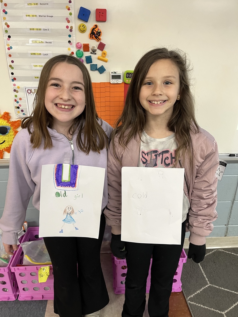 Two students dress in  outfits with a rhyming theme.