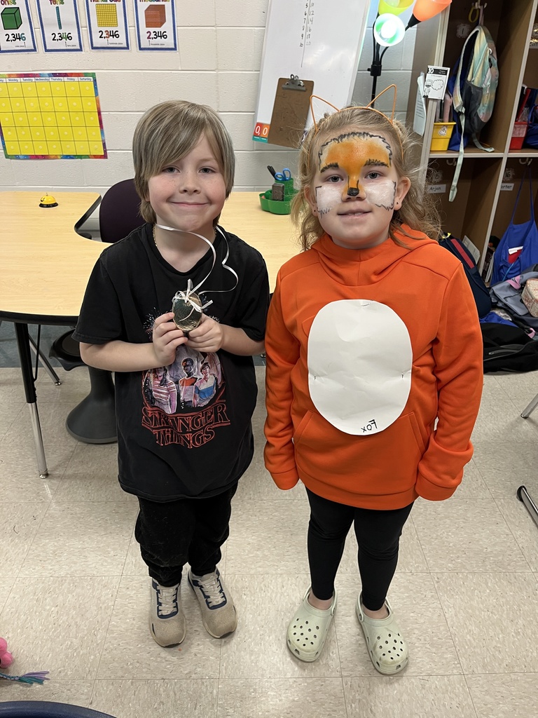 Two students dress in  outfits with a rhyming theme.