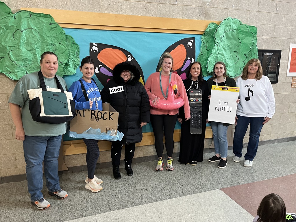 Two students dress in  outfits with a rhyming theme.