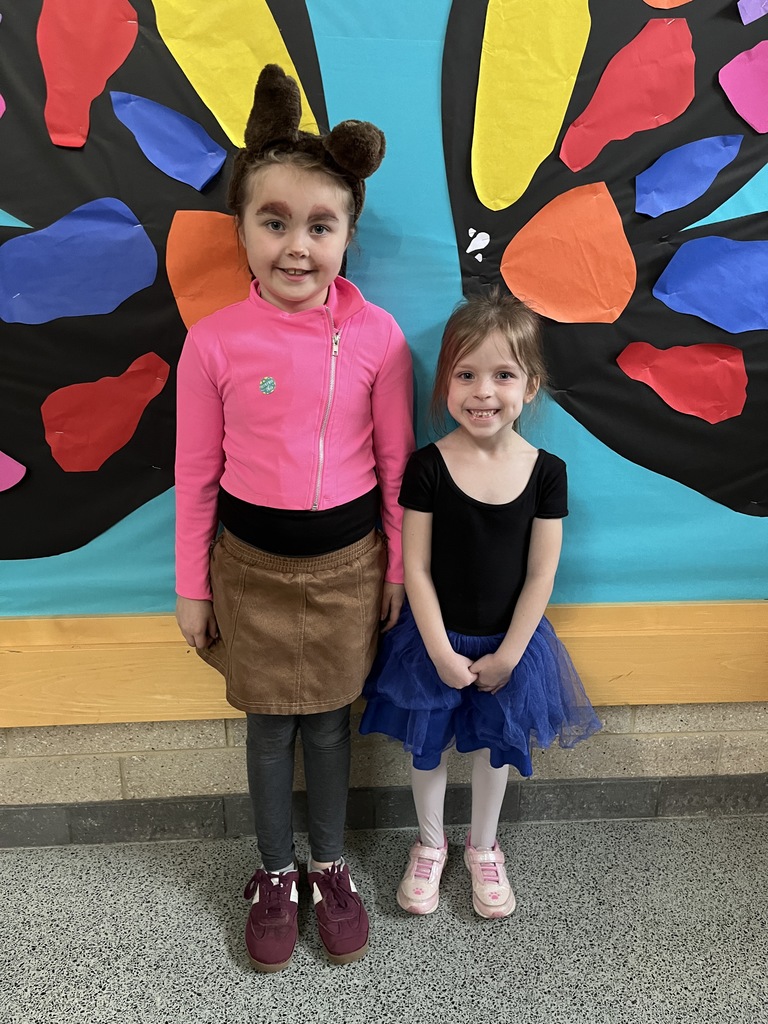 Two students dress in  outfits with a rhyming theme.
