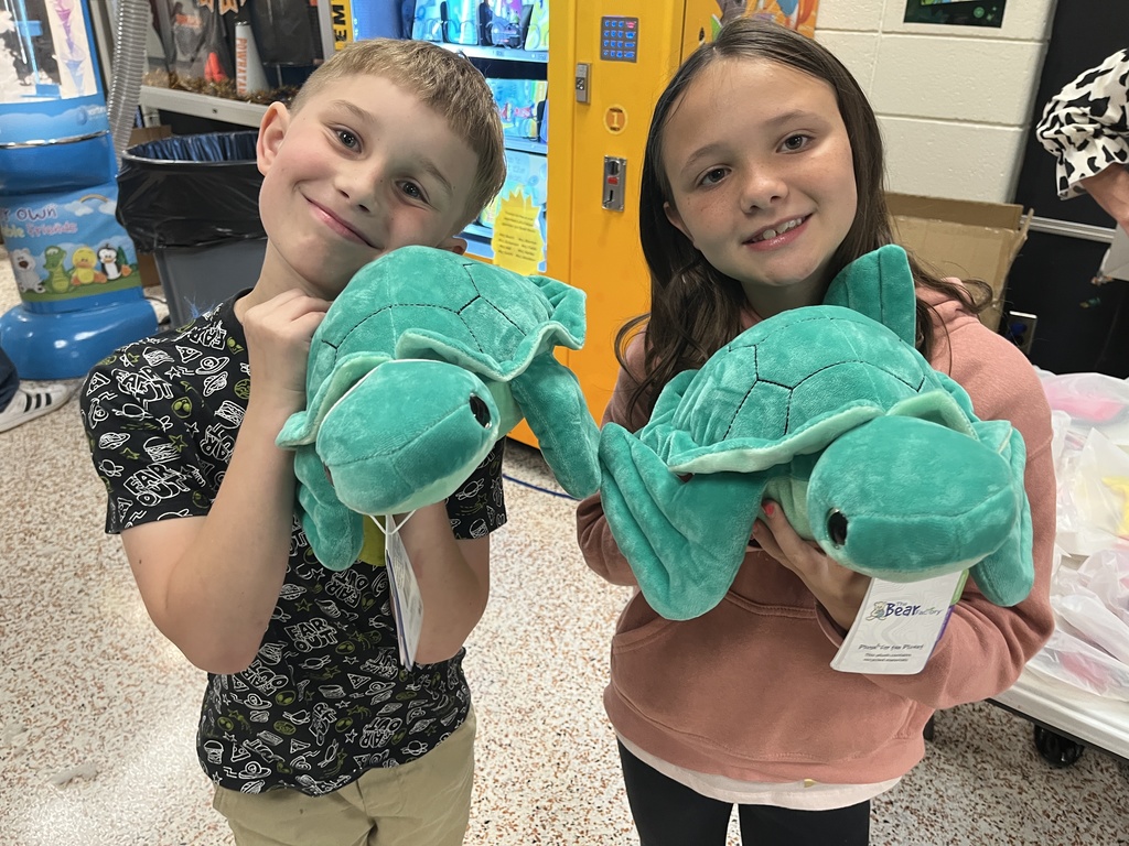 Children pose with their new stuffed animals.