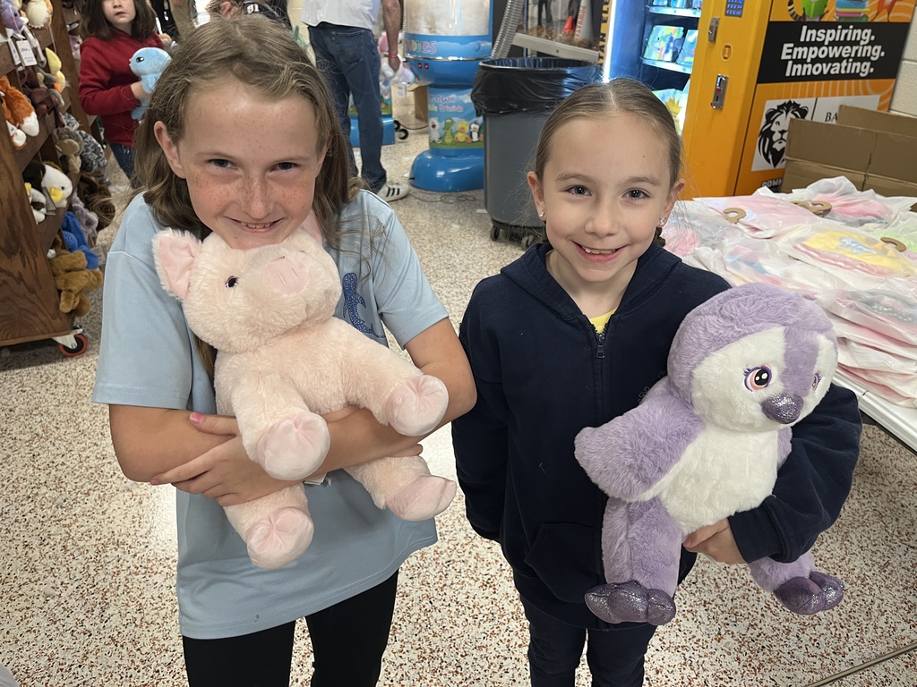 Children pose with their new stuffed animals.