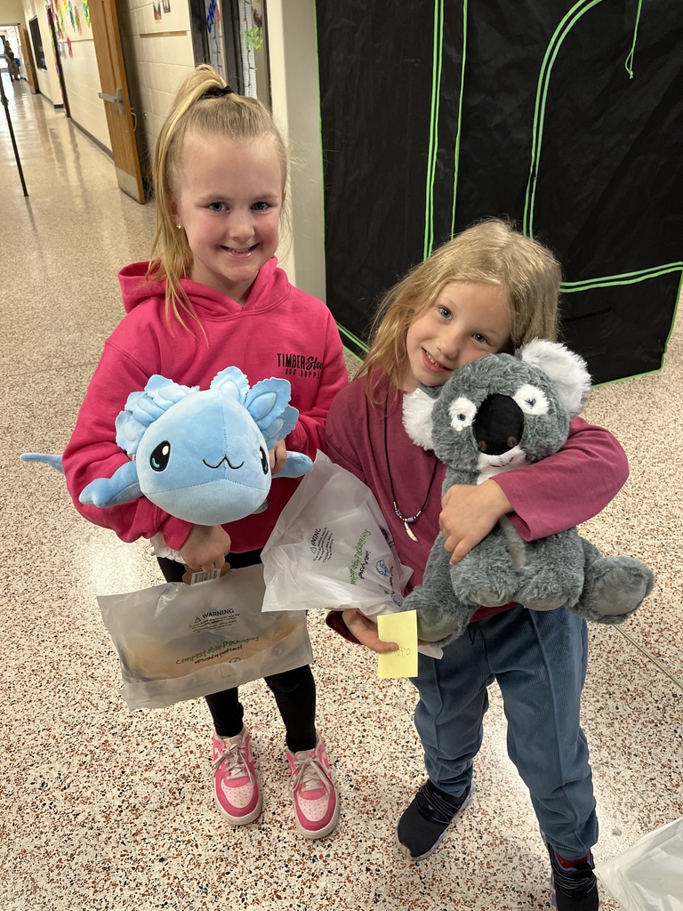 Children pose with their new stuffed animals.