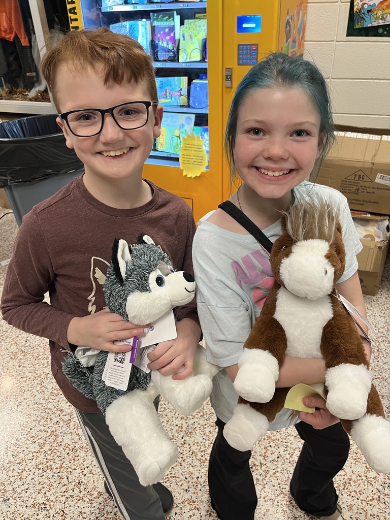 Children pose with their new stuffed animals.