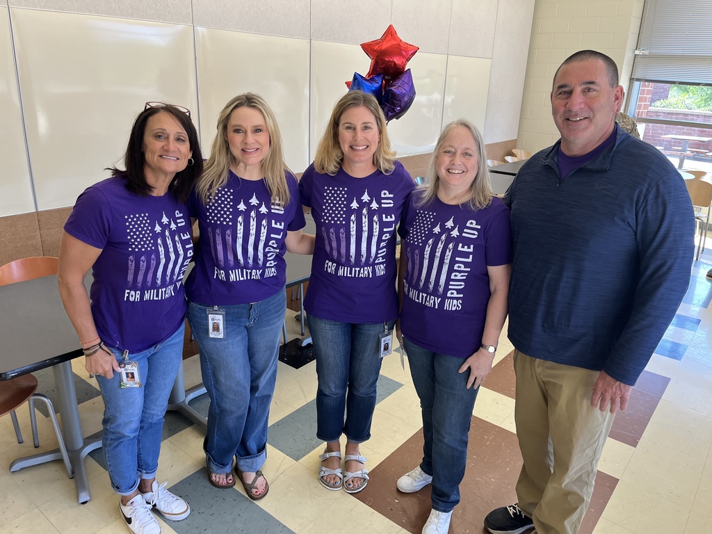 A group of counselors  pose for a group photo.
