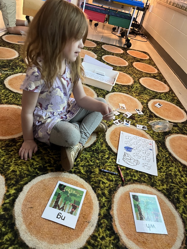 A student hard at work in a literacty station in class. 