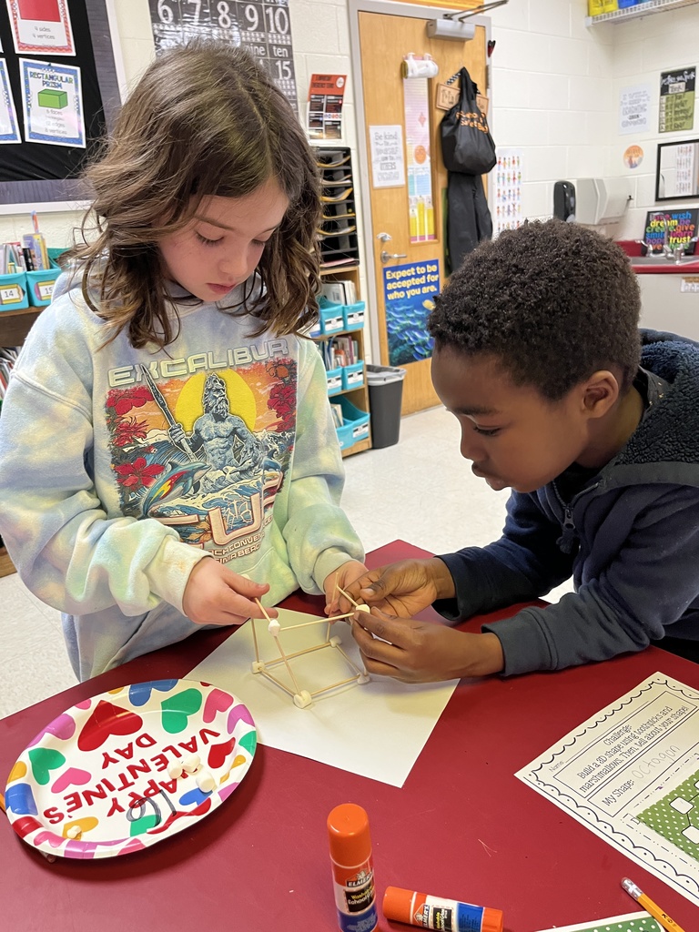 Students use marshmallows and toothpicks to build geometric shapes.