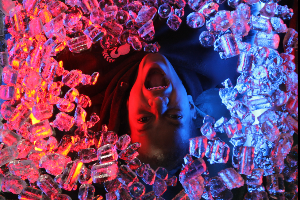 An artistic portrait photograph using ice and lighting. 