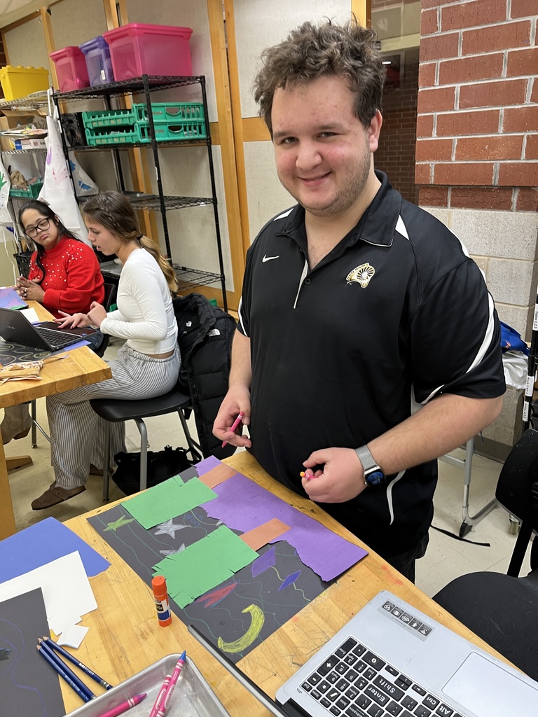 Students in an adaptive art class work on a Van Gogh-themed project.