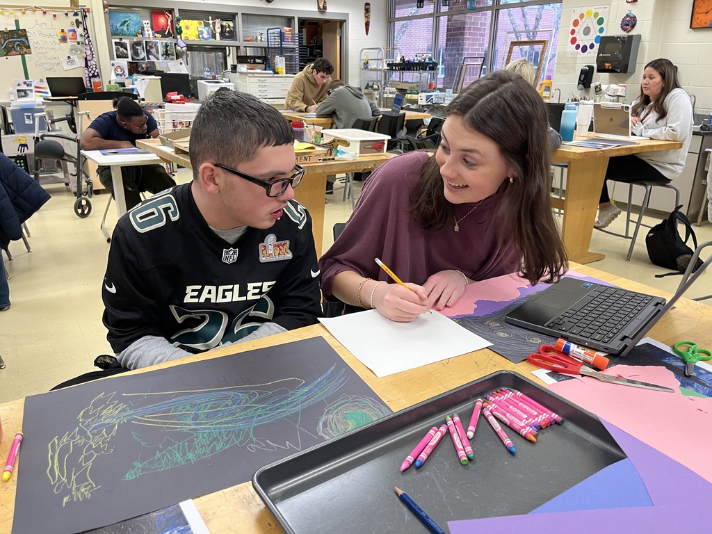 Students in an adaptive art class work on a Van Gogh-themed project.