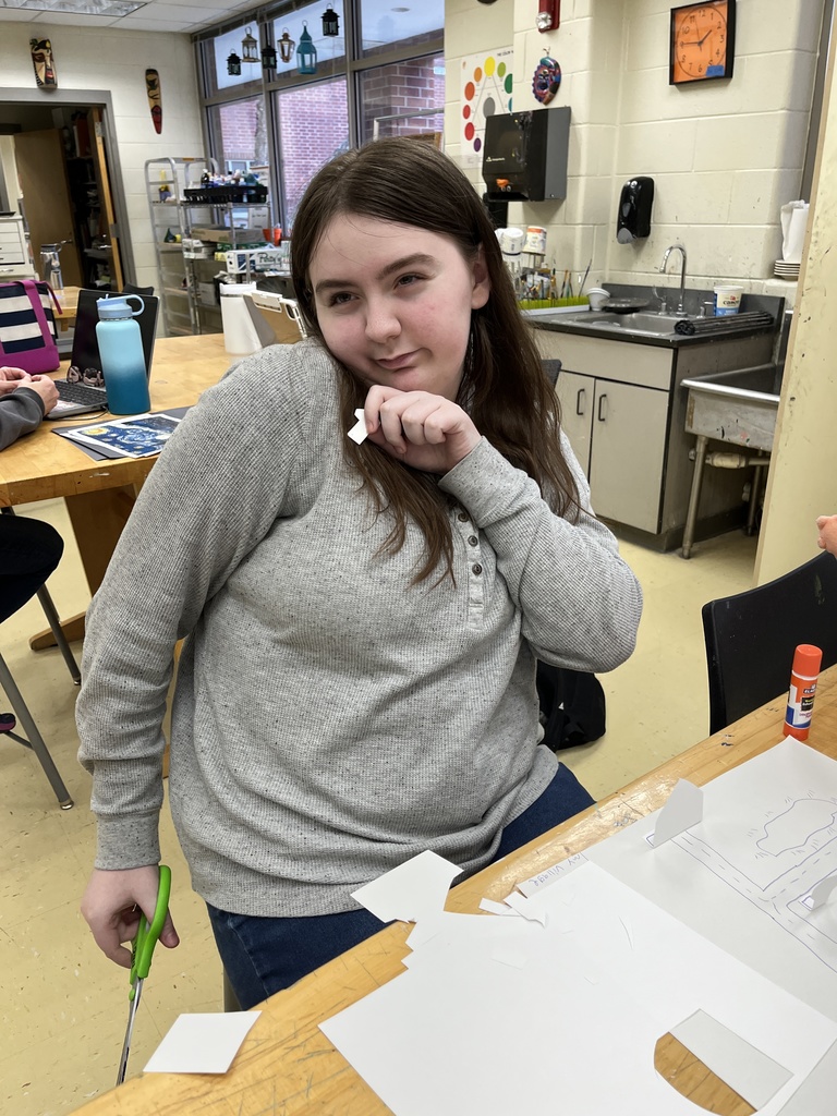 A student in an adaptive art class works on a Van Gogh-themed project.