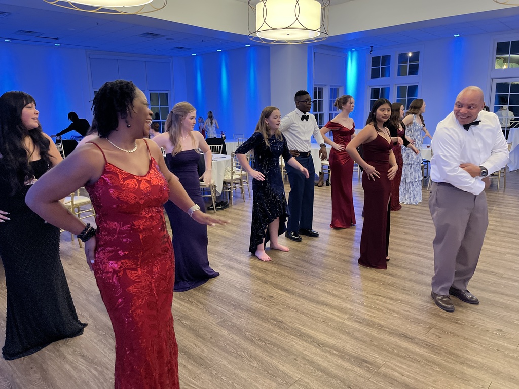 Students and adults dance during a JROTC military ball.