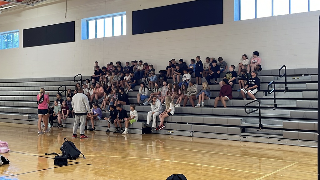 Teachers give instructions to students on the first day of school.