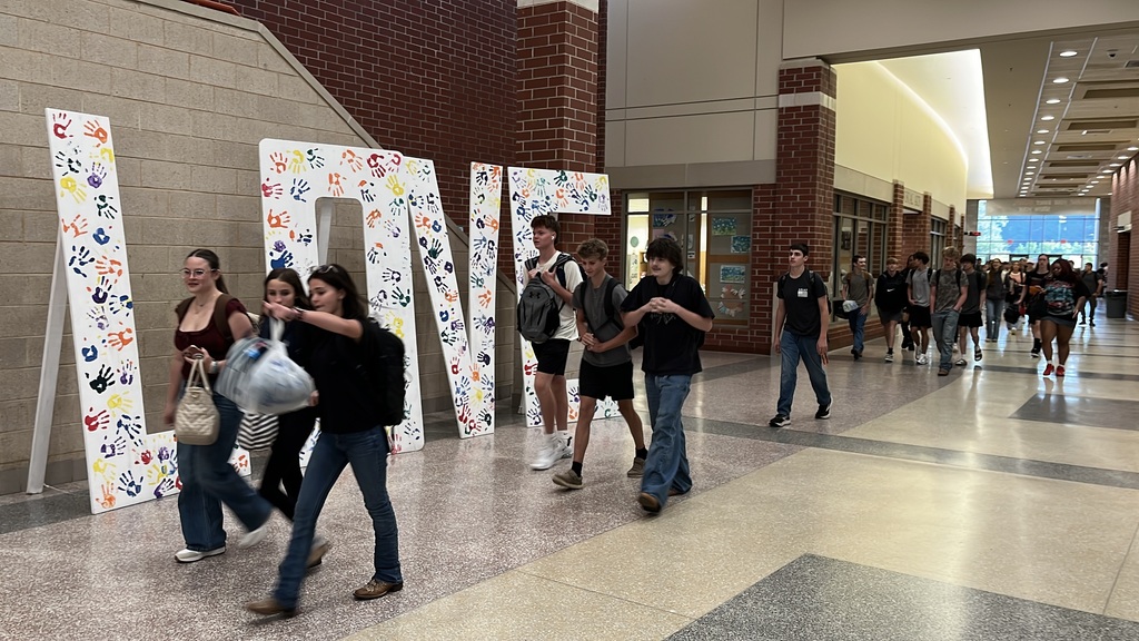 Students walk in the high school hallway on the second day of school.