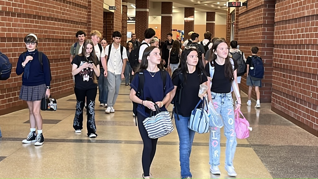 Students walk in the high school hallway on the second day of school.