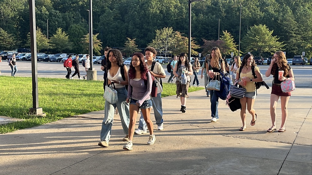 Students walk into the high school on the second day of school.