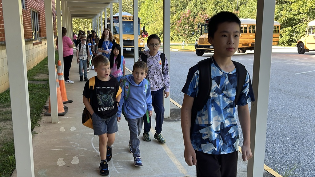 Students walk into school.