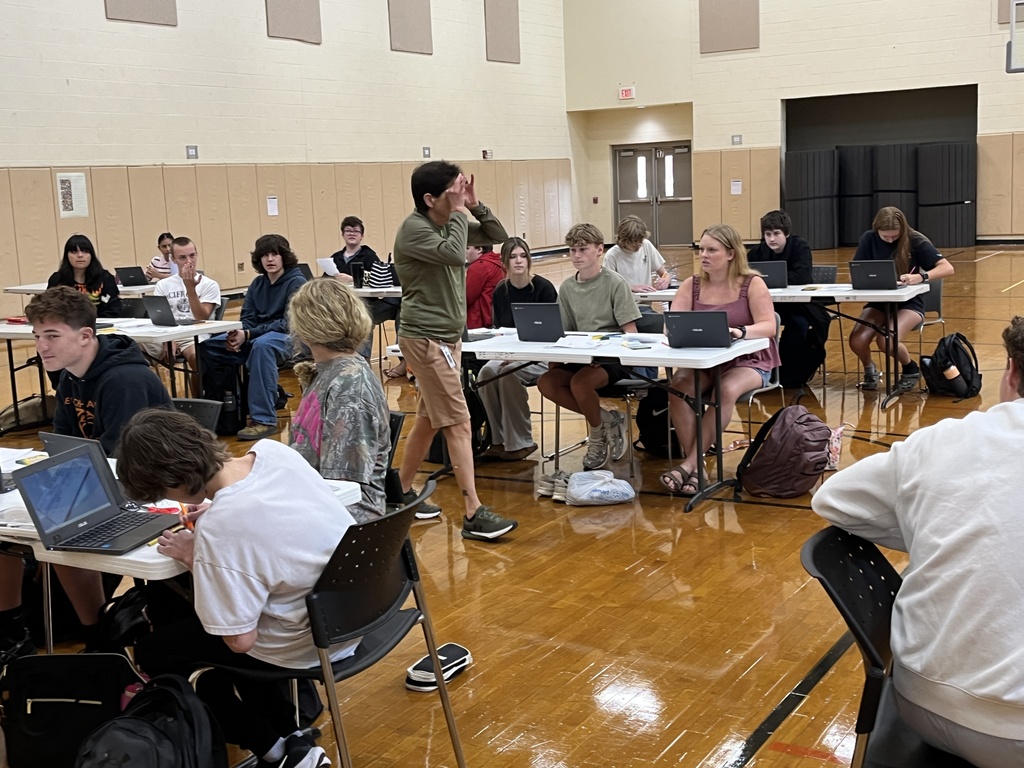 A drivers ed teacher talks to her students about the process of a DMV visit.