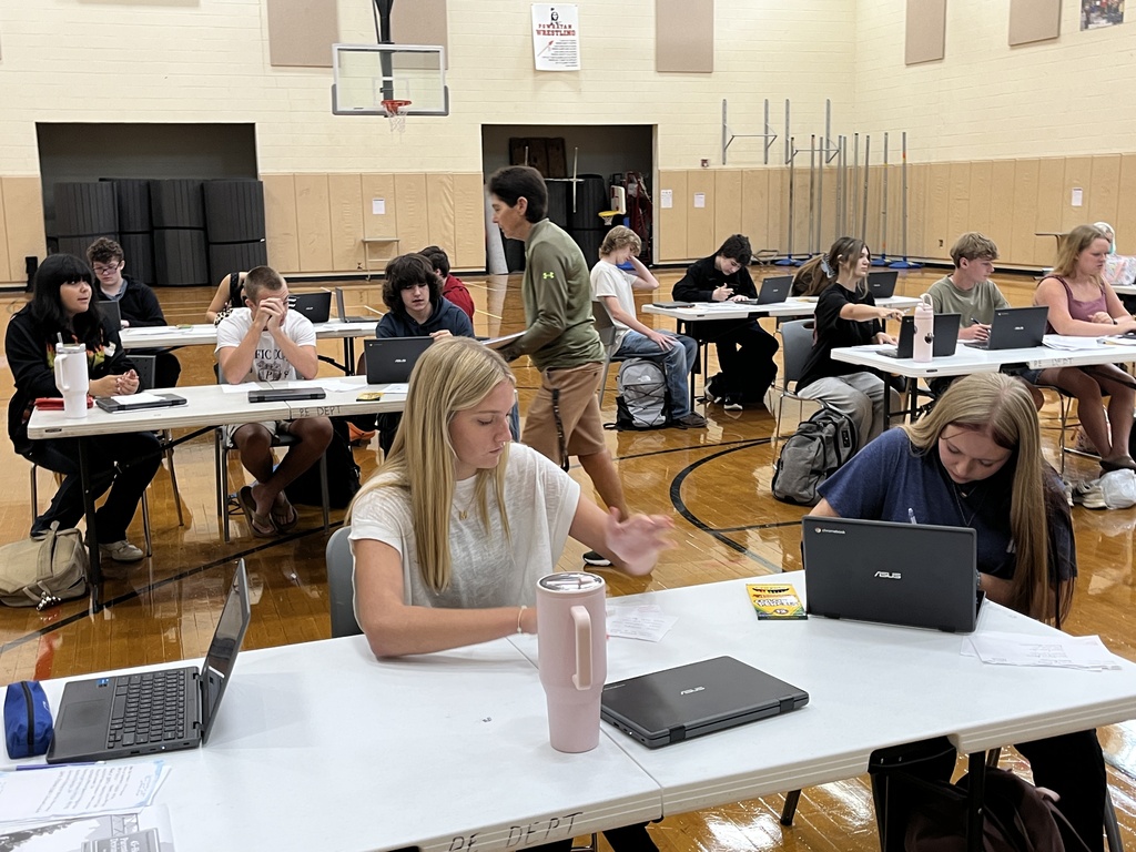 A drivers ed teacher talks to her students about the process of a DMV visit.