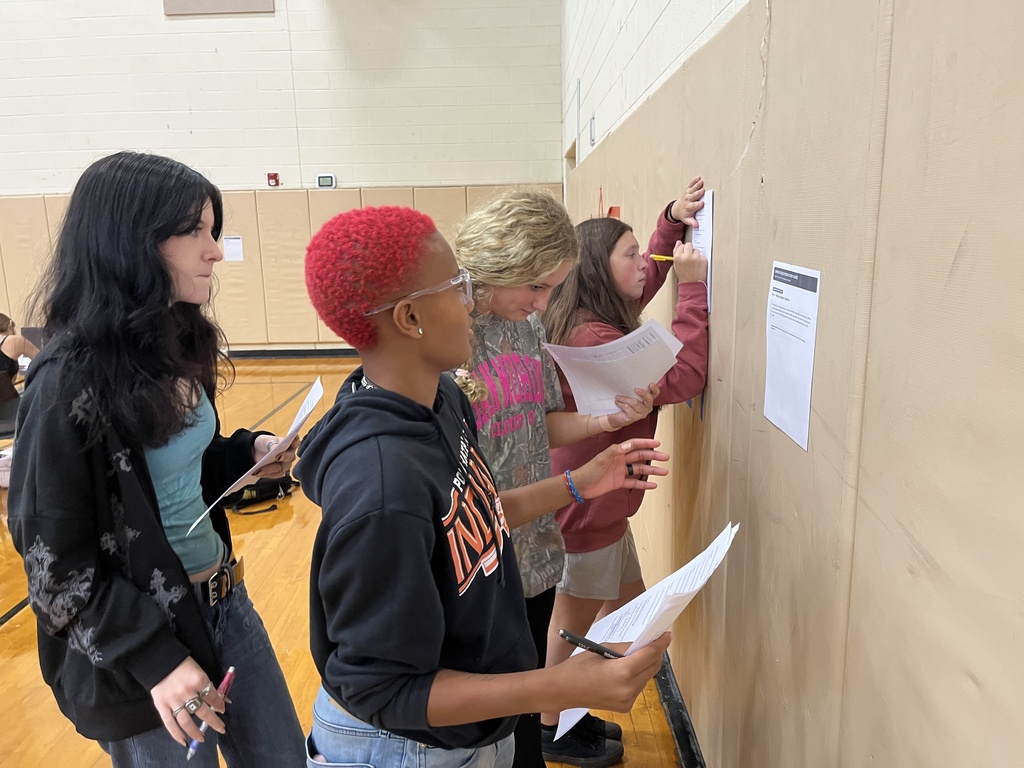 Students in drivers ed class participate in stations to help them learn about the process of a DMV visit.