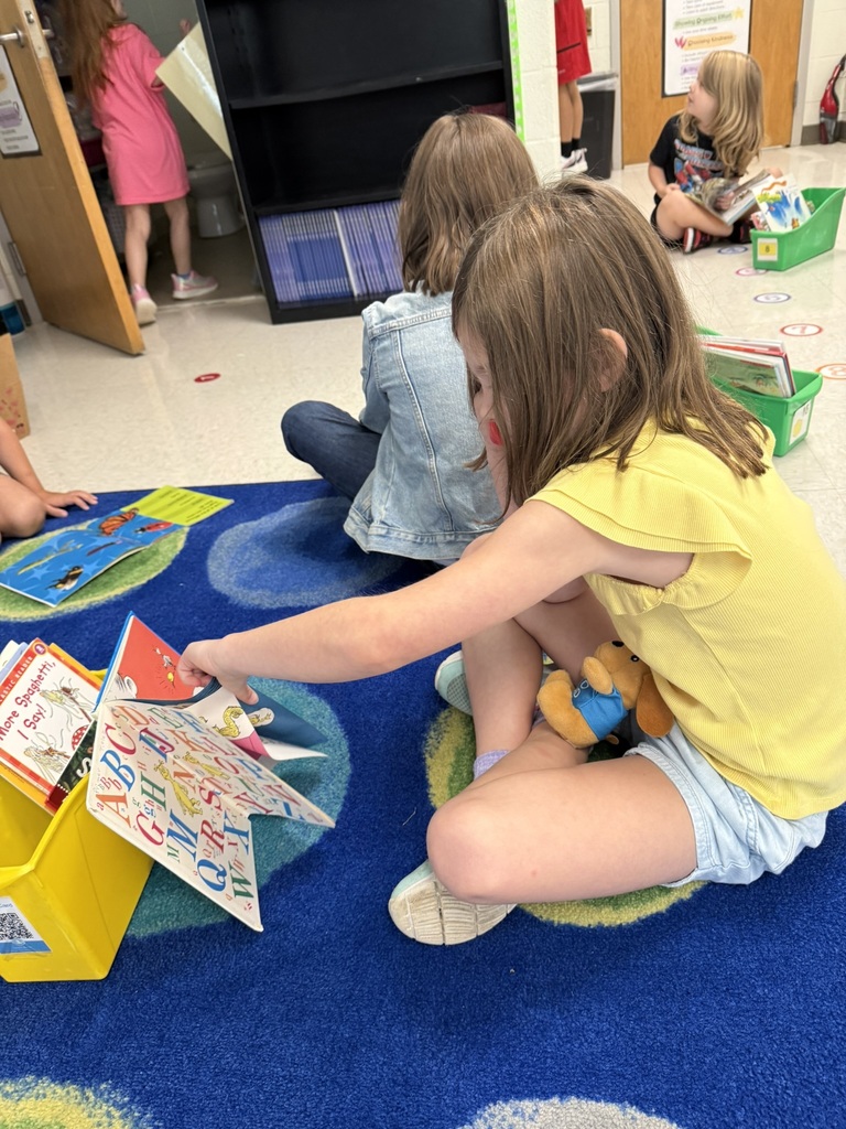 First graders on the first day of school participates in a read to self activity.