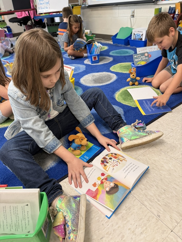 First graders on the first day of school participates in a read to self activity.